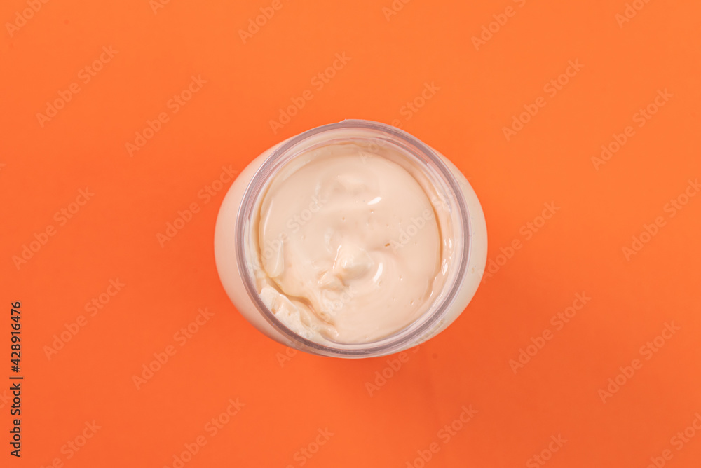 Mayonnaise can on the orange background Mayonnaise can on the orange background