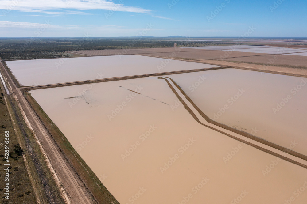 Huge water filled dams in the far outback of New South Wales ready to feed cotton crops.