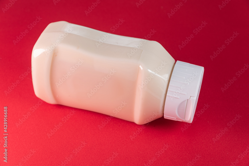 Mayonnaise can on the red background Mayonnaise can on the red background
