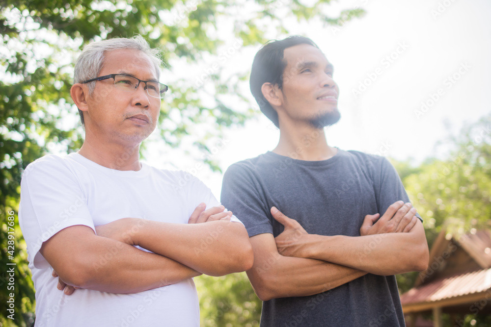 Two people old man and son exercise standing outdoor