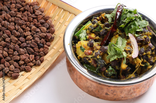 Bengali style black chickpeas chana sola lentil dal peas bhuna recipe onion garlic dry chili bay leaf cinnamon fumaric power cumin seeds salt photo