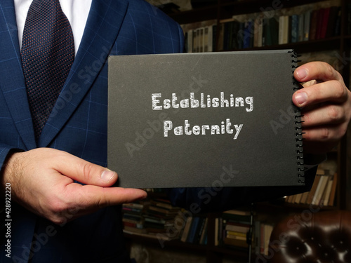  Juridical concept about Establishing Paternity with inscription on the sheet.