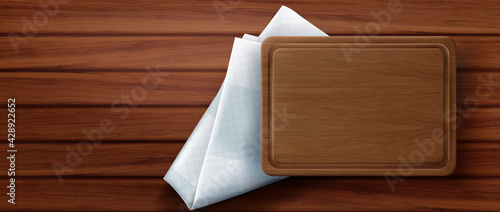 Wooden cutting board stand on kitchen napkin and wood table surface top view. Rectangular empty tray on folded white tablecloth, eco friendly utensil of natural material realistic 3d vector background