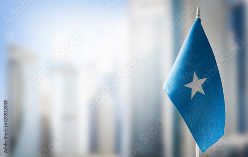 A small flag of Somalia on the background of a blurred background