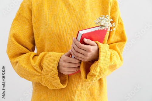 Person in yellow sweater ho...