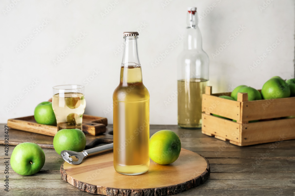 Composition with fresh apple cider on wooden table Composition with fresh apple cider on wooden table