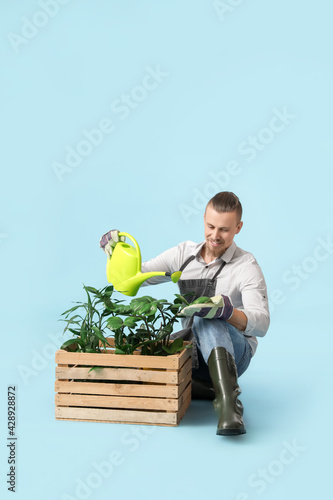 Young male gardener on colo...