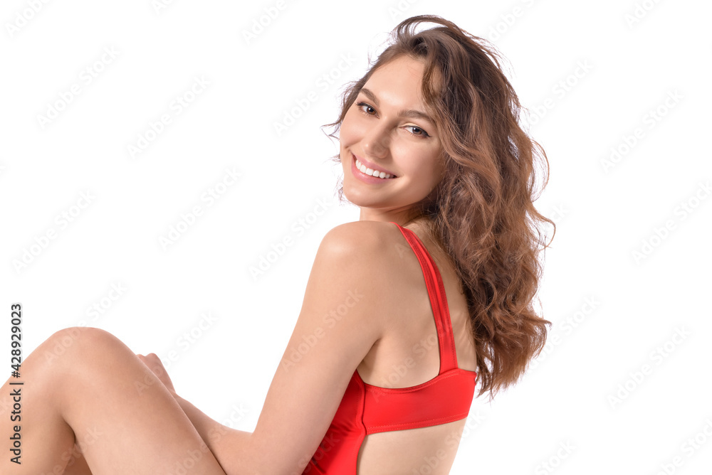 Obraz premium Beautiful young woman in swimsuit on white background