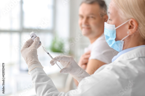 Doctor vaccinating patient ...