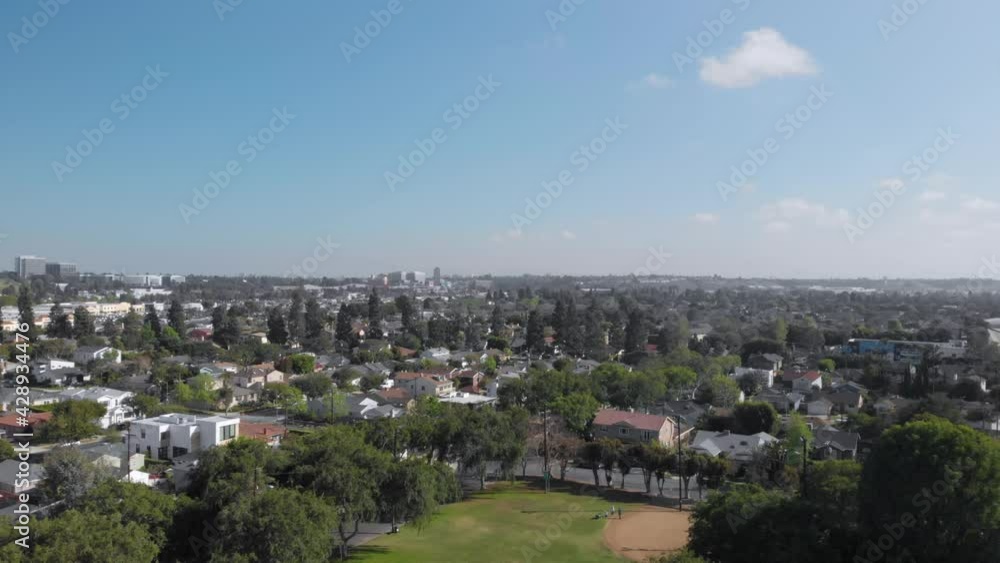 Aerial flyover quiet Los Angeles neighborhood public park, Los Angeles, Califonia, Daytime and Blue Sky Aerial flyover quiet Los Angeles neighborhood public park, Los Angeles, Califonia, Daytime and Blue Sky