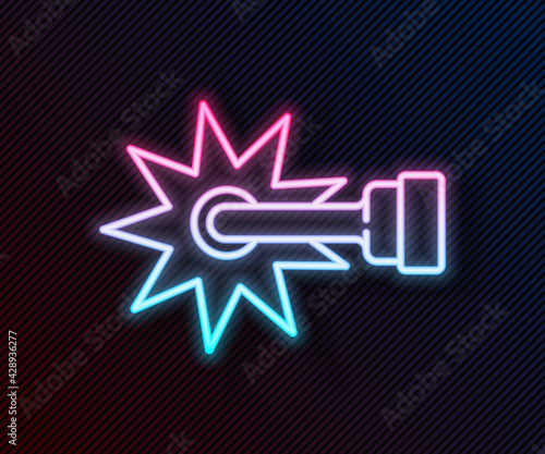 Glowing neon line Cowboy horse riding spur for boot icon isolated on black background. Vector