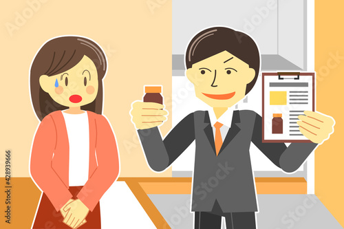 主婦に訪問販売をするセールスマン