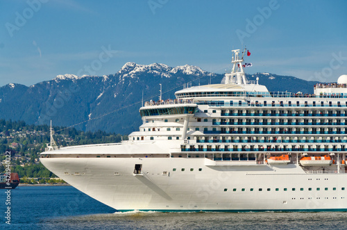 Fragment of cruise ship over snow mountain in the harbour in Vancouver, Canada.