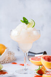 Frozen Mezcal or mescal Margarita cocktail with grapefruit and lime