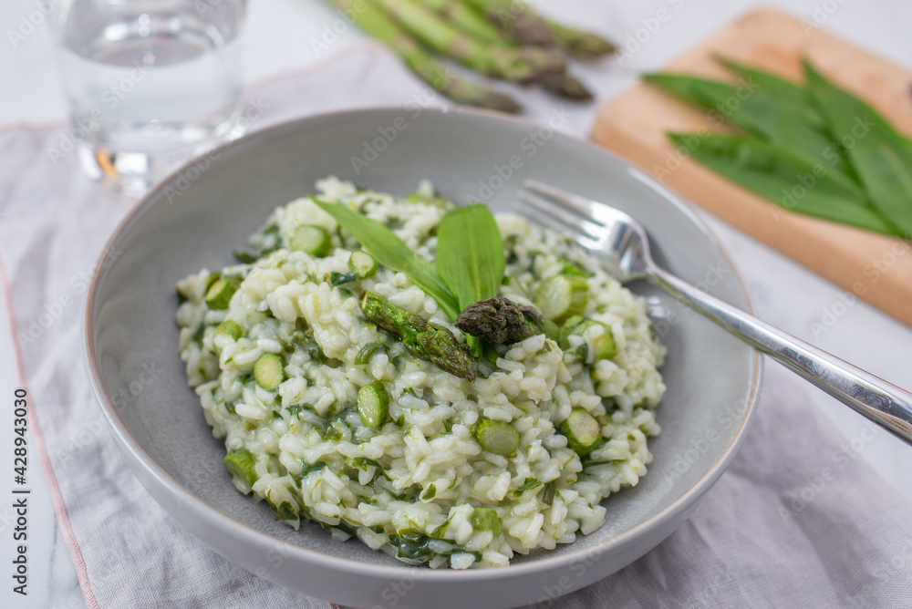 Spring food; Delicious risotto with asparagus and wild garlic