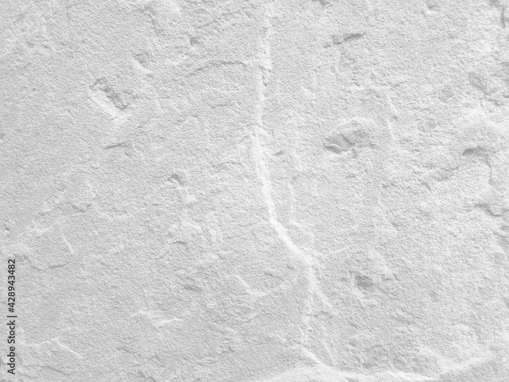 Obraz premium Rough white stone wall background in vintage style for graphic design or wallpaper
