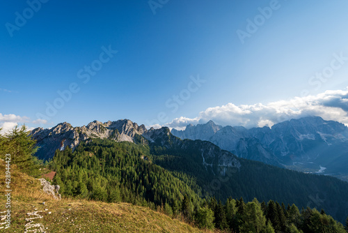 The Julian Alps seen from the Monte Santo di Lussari with the Cima del Cacciatore (Peak of the Hunter) and the mountain range of Jof di Montasio and Jof Fuart. Friuli Venezia Giulia, Italy, Europe. © Alberto Masnovo