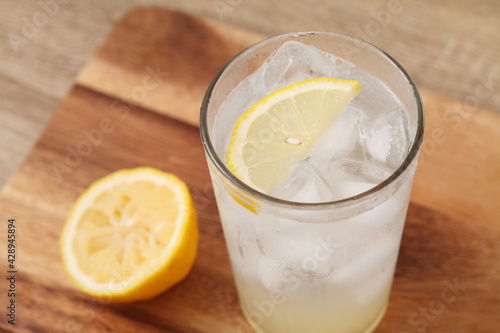 lemonade in glass on wooden tray