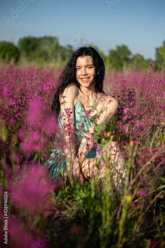 Girl in a field in a dress
