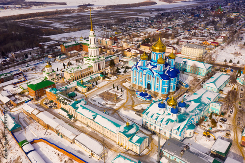 Aerial view of the Nativity-Bogoroditsky monastery surrounded by residential buildings in the center of Zadonsk..in winter, Russia