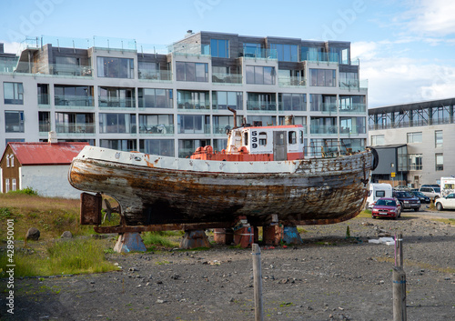 An old fishing boat in a dry dock for maintenance and repair