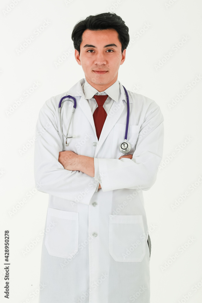 Portrait of a professional medical male doctor standing on white background with crossed arms, wearing white gown coat, and stethoscope, smiling, looking at a camera proudly in his occupation. Portrait of a professional medical male doctor standing on white background with crossed arms, wearing white gown coat, and stethoscope, smiling, looking at a camera proudly in his occupation.