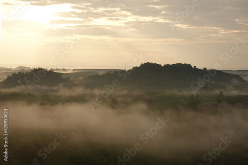 morning mist over the mountain  Landscape view of Khao Na Nai Luang temple on peak mountain at Surat Thani Province  Southern of Thailand
