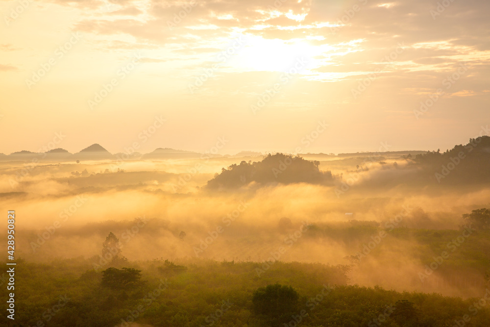 misty morning sunrise, Landscape view of Khao Na Nai Luang temple on peak mountain at Surat Thani Province, Southern of Thailand