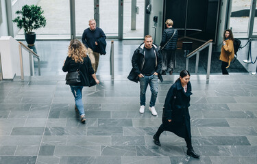 Business people walking through a office hallway