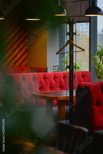 Restaurant interior background, red and green tones. Inside an empty restaurant