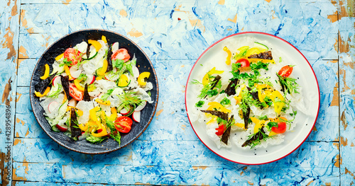 Vegetable salad decorated with rice paper green salad