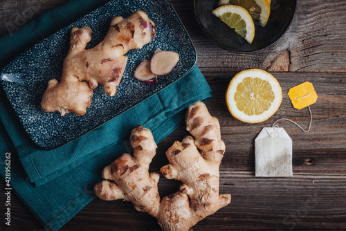 Fresh raw ginger roots with lemon