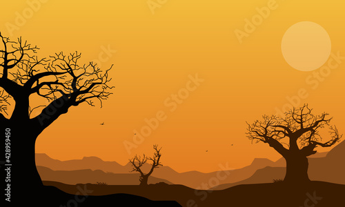 A dramatic silhouette of dry tree silhouettes under a magnificent twilight sky. Vector illustration © City