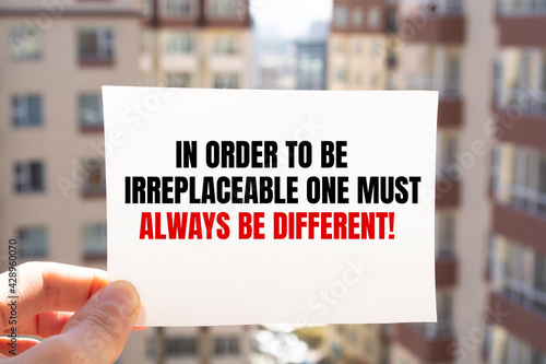 The motivational quote In order to be irreplaceable one must always be different photo