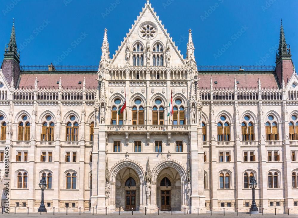 Budapest, Hungary - August 31, 2019: majestic facade of the Hungarian Parliament building, built in the neo-Gothic style. Famous state building and most popular tourist attraction in Budapest, capital
