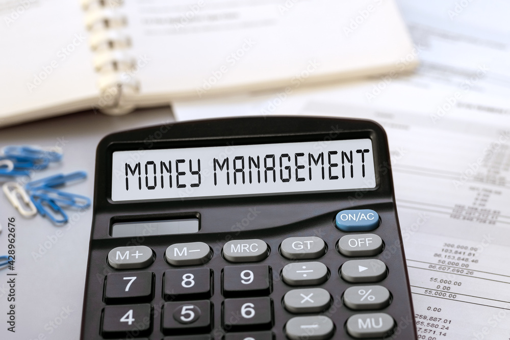 Calculator with the words Money Management on the display