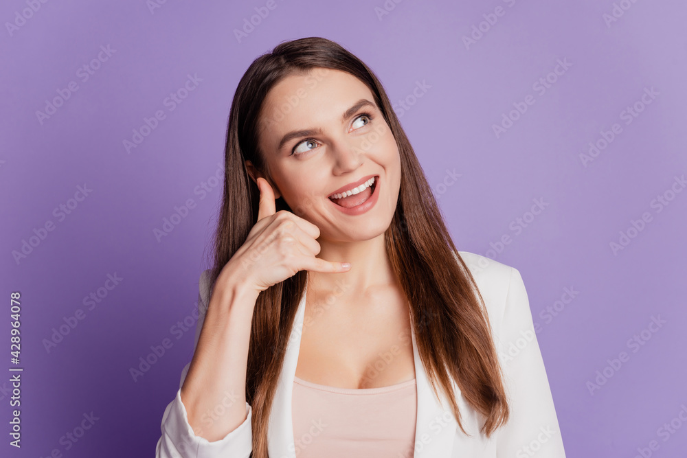 Close up portrait of lady hold fingers ear phone form look empty space wear formal suit posing on purple wall Close up portrait of lady hold fingers ear phone form look empty space wear formal suit posing on purple wall