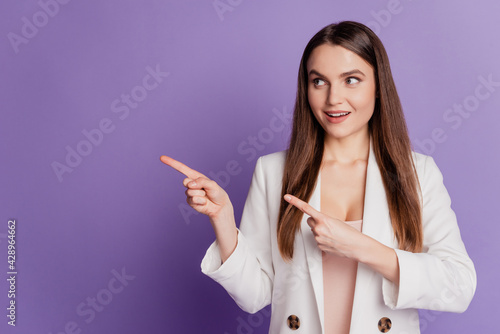 Close up portrait of lady indicate fingers empty space look side wear formal suit posing on violet wall