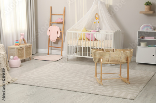 Cozy baby room with crib and other furniture. Interior design