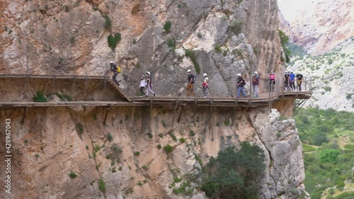 Malaga, Spain. Circa April 2021.People in Royal Trail (El Caminito del Rey) in Gorge of the Gaitanes Chorro, Malaga province.