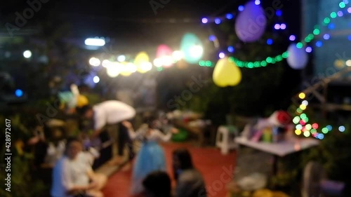 Wallpaper Mural Blurred people in daughter birthday party at home in night. happy event time. Out of focus video. Torontodigital.ca