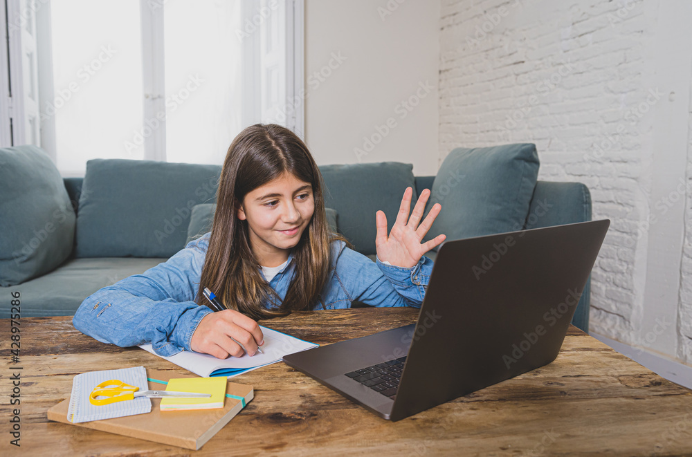 Teenage girl on laptop studying online at home as high school is closed due to new COVID-19 Lockdown Teenage girl on laptop studying online at home as high school is closed due to new COVID-19 Lockdown