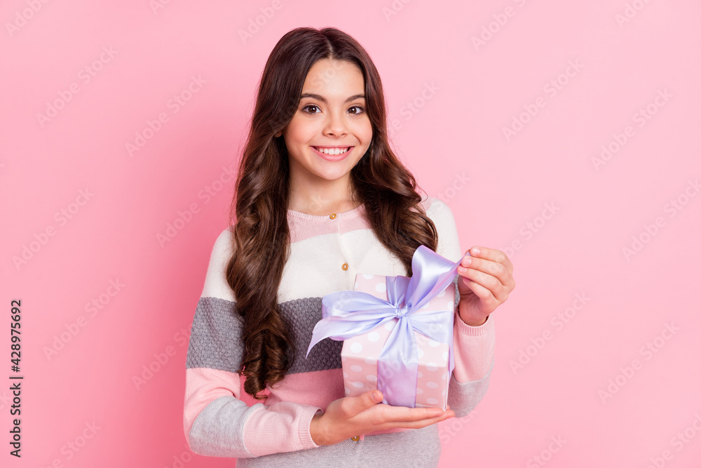 Photo of young cheerful girl happy positive smile get present box celebration holiday isolated over pastel color background Photo of young cheerful girl happy positive smile get present box celebration holiday isolated over pastel color background