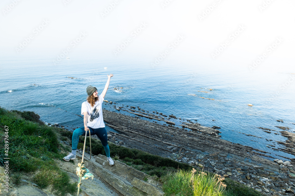 Naklejka premium Hiking on the coast between Zumaia and Deba on the Camino del Norte, Basque Country