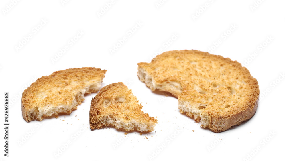 Broken rusk with crumbs isolated on white background Broken rusk with crumbs isolated on white background
