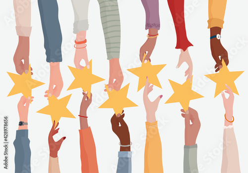Customer feedback concept. Rating concept. Hand giving a star to another hand.Customer service.Opinion and evaluation of the consumer or customer on quality and assistance.Rating.Survey