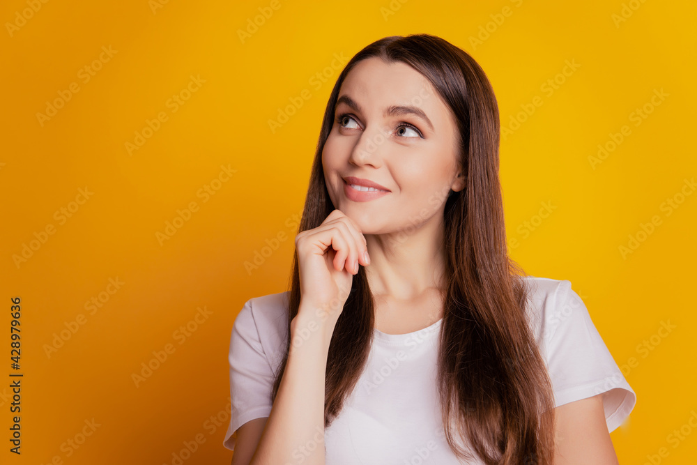 Photo of lady finger chin look empty space imagine thoughts wear white t-shirt posing on yellow background Photo of lady finger chin look empty space imagine thoughts wear white t-shirt posing on yellow background