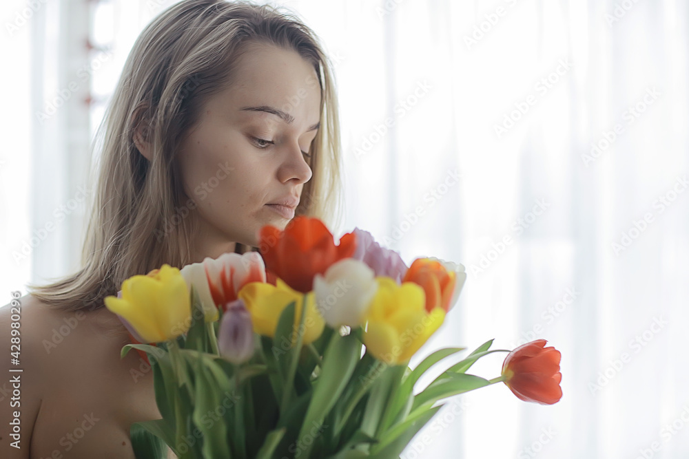 female bouquet of tulips, portrait spring image of a girl and flowers