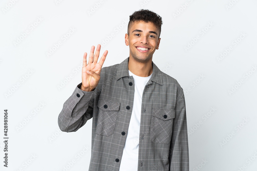 Young brazilian man isolated on white background happy and counting four with fingers Young brazilian man isolated on white background happy and counting four with fingers