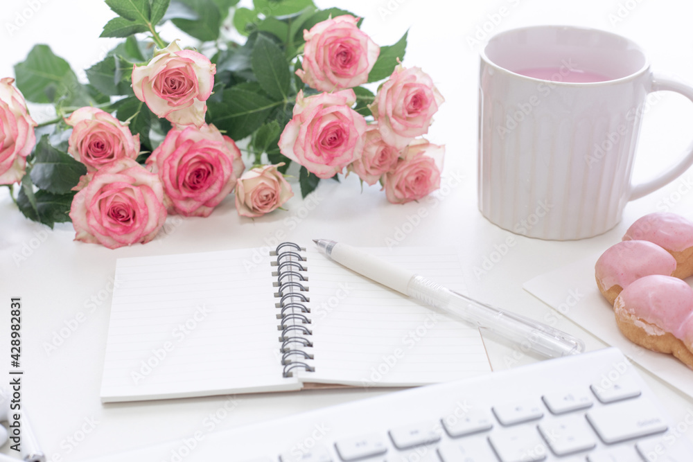 Pink concept. Rose, keyboard and drink Pink concept. Rose, keyboard and drink